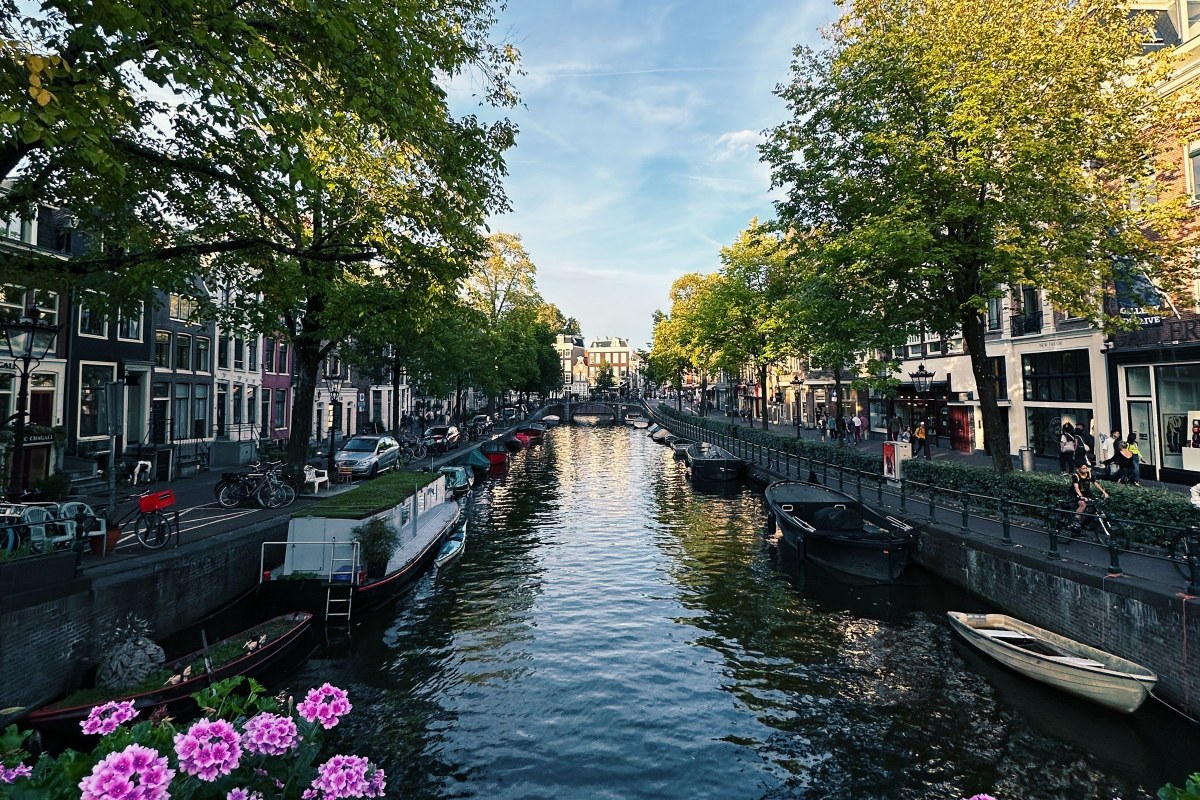 Amsterdam canal with houses and boats
